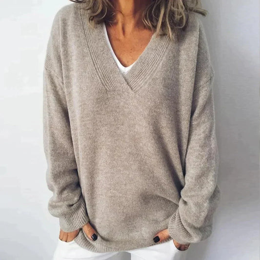 Women's gray V-neck knit sweater with long sleeves and ribbed trims