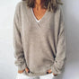Women's gray V-neck knit sweater with long sleeves and ribbed trims