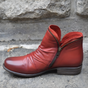 Ankle boots with diagonal zipper, rounded toe and low heel