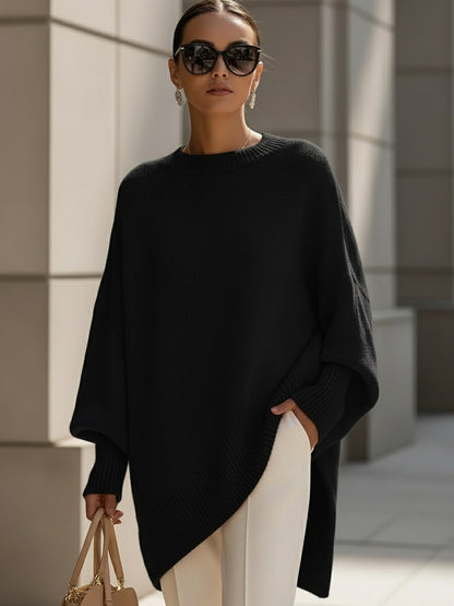 Women's oversized knit sweater with crew neck and asymmetric longline hem