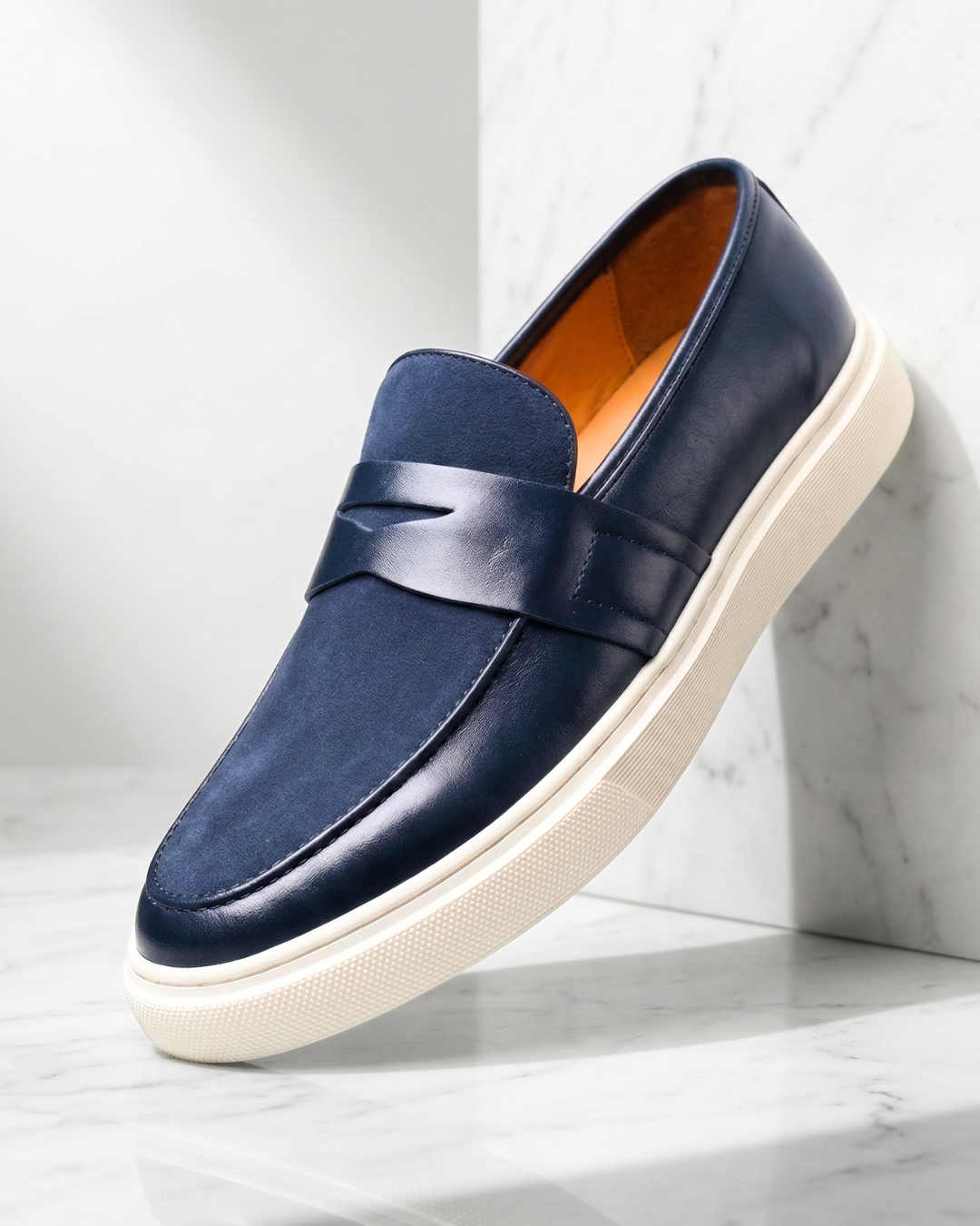Slip-on penny loafer with textured vamp panel and flat contrast sole