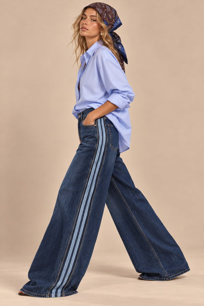 Women's dark blue wide-leg jeans with contrasting vertical side stripes