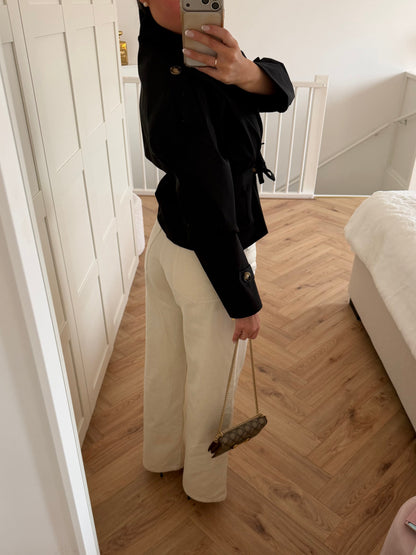 Women's black belted trench jacket with high collar and long sleeves