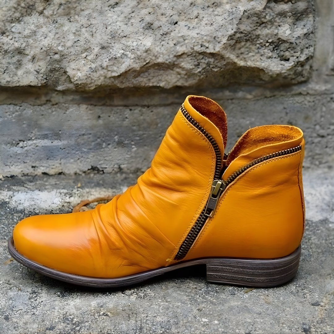Ankle boots with diagonal zipper, rounded toe and low heel