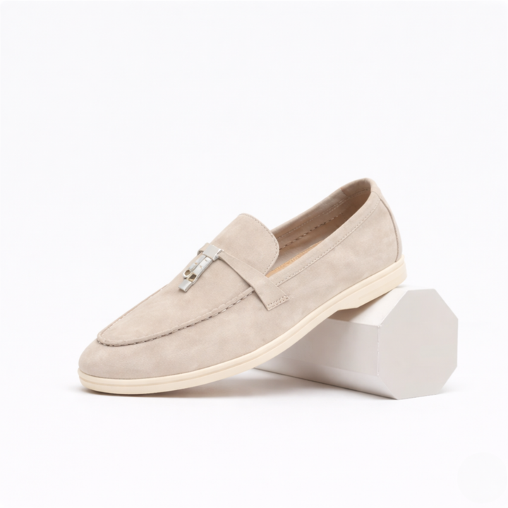 Women's slip-on loafers with flat soles, stitched toes and metal vamp trim