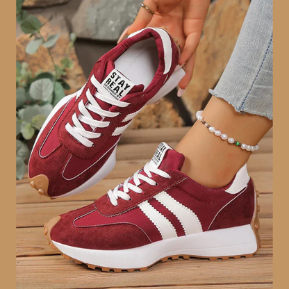 Women's retro lace-up sneakers with striped side panels and flat textured soles