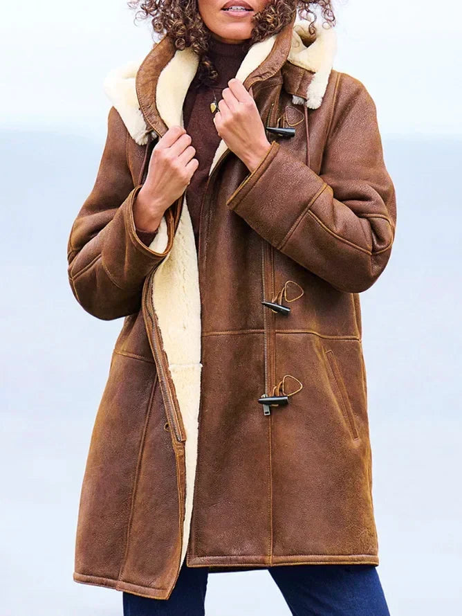 Women's brown hooded coat with cream trim and toggle fastenings