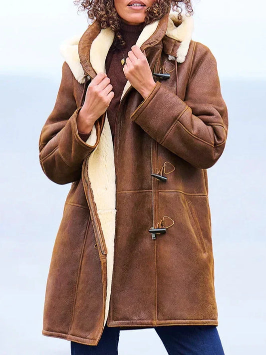 Women's brown hooded coat with cream trim and toggle fastenings