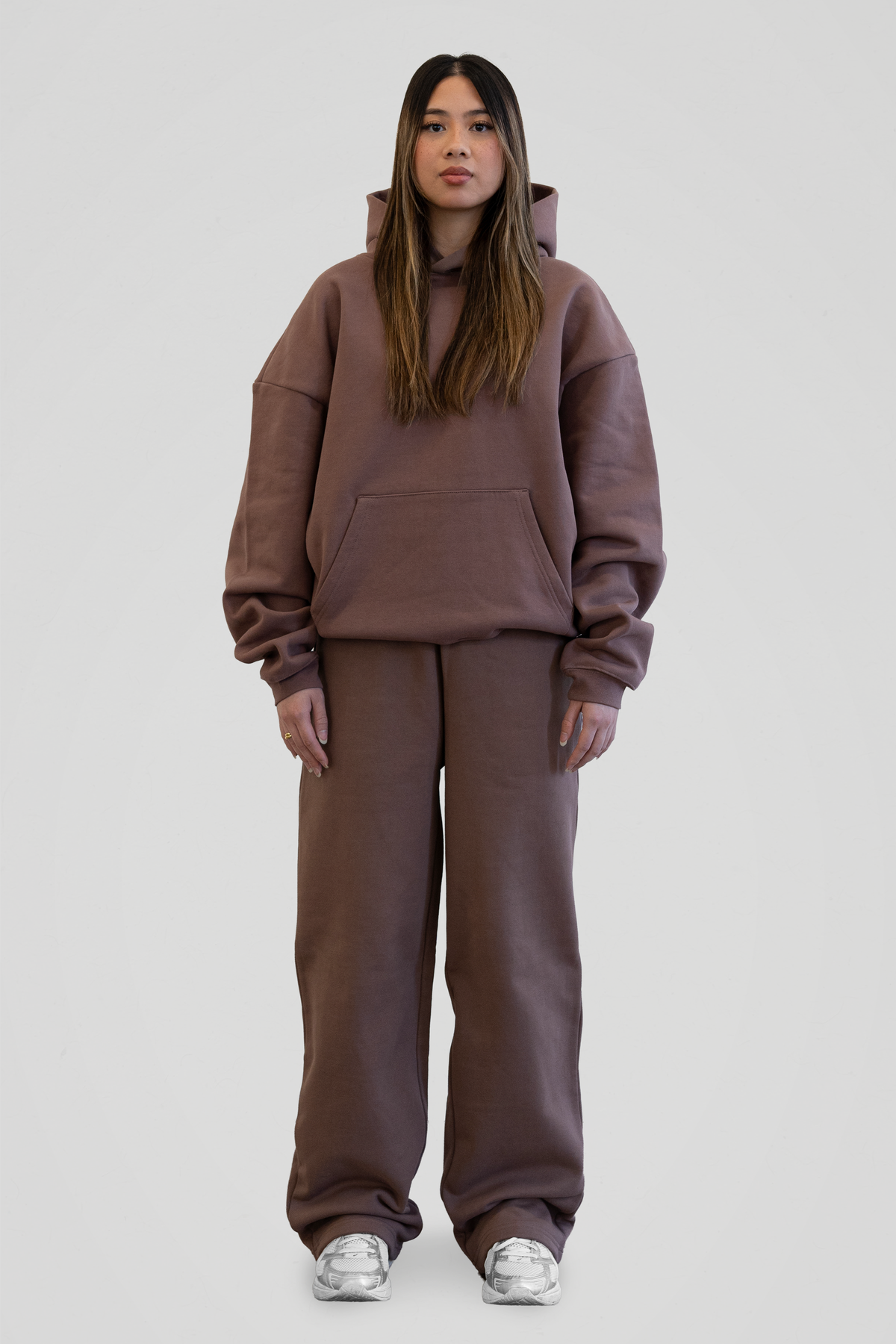 Women's brown hooded sweatshirt with long sleeves and front kangaroo pocket