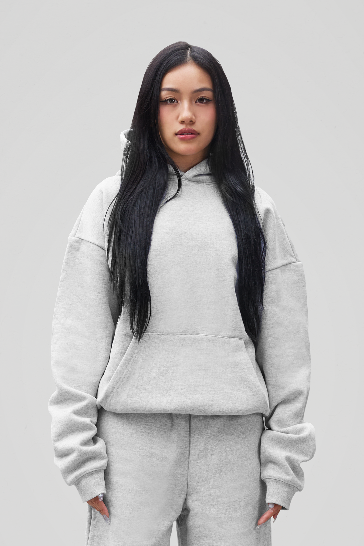 Women's grey pullover hoodie with hood, long sleeves and kangaroo pocket