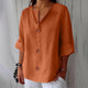 Women's relaxed V-neck shirt with buttons and three-quarter sleeves