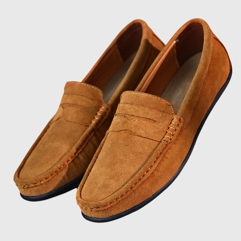 Classic slip-on loafers with penny strap and moc-toe stitching