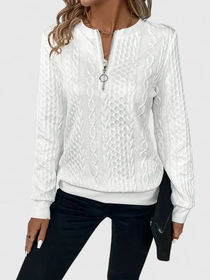 Women's textured cable knit sweater with zip neckline and ribbed trims