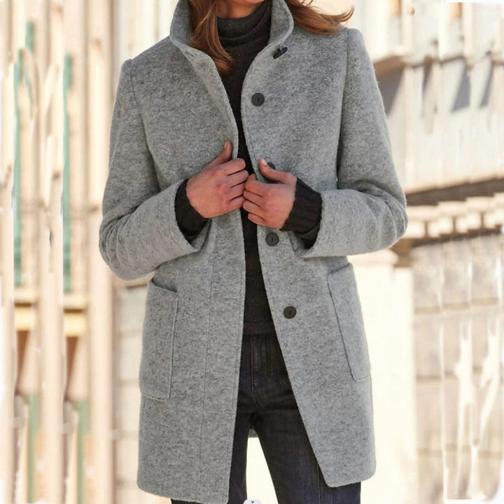 Women's straight mid-thigh coat with stand collar, long sleeves, buttons and patch pockets