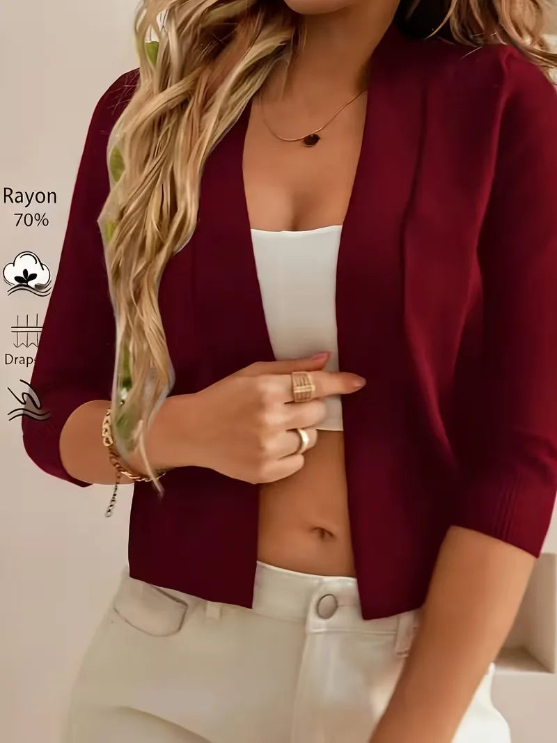 Women's open-front cardigan with three-quarter sleeves and ribbed cuffs