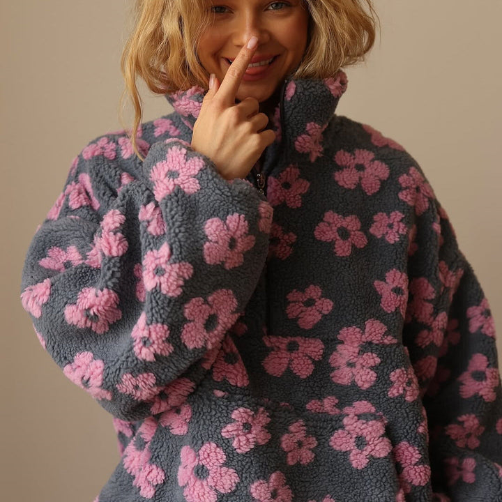 Women's floral fleece pullover with half-zip collar and front pocket