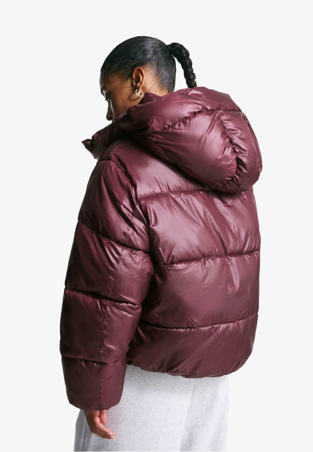 Women's burgundy quilted hooded puffer jacket with snap front and front pockets