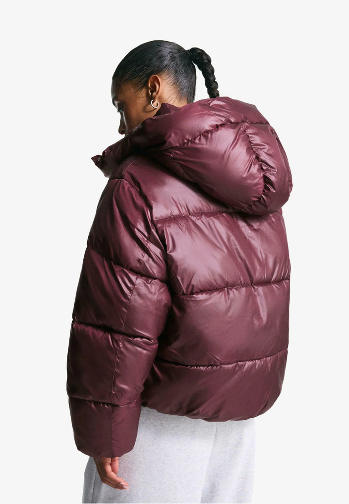 Women's burgundy quilted hooded puffer jacket with snap front and front pockets