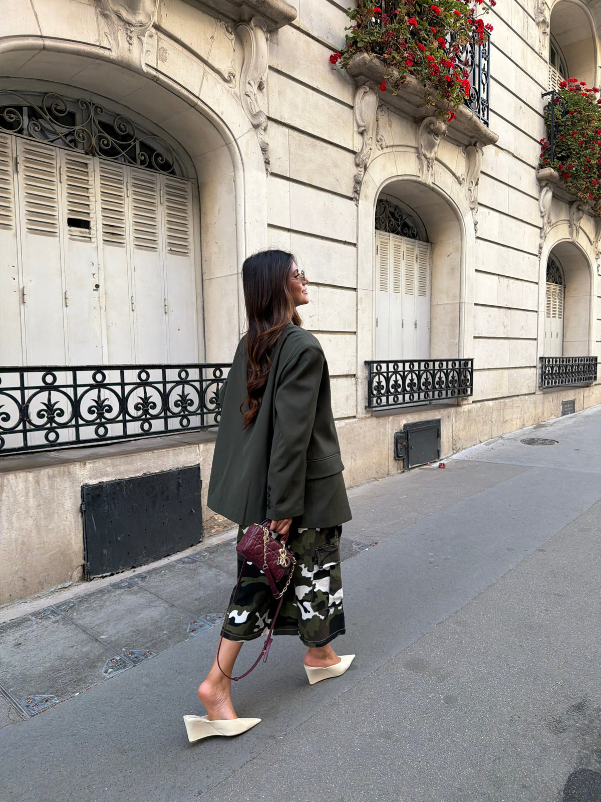 Women's deep green longline blazer with notched lapels and long sleeves