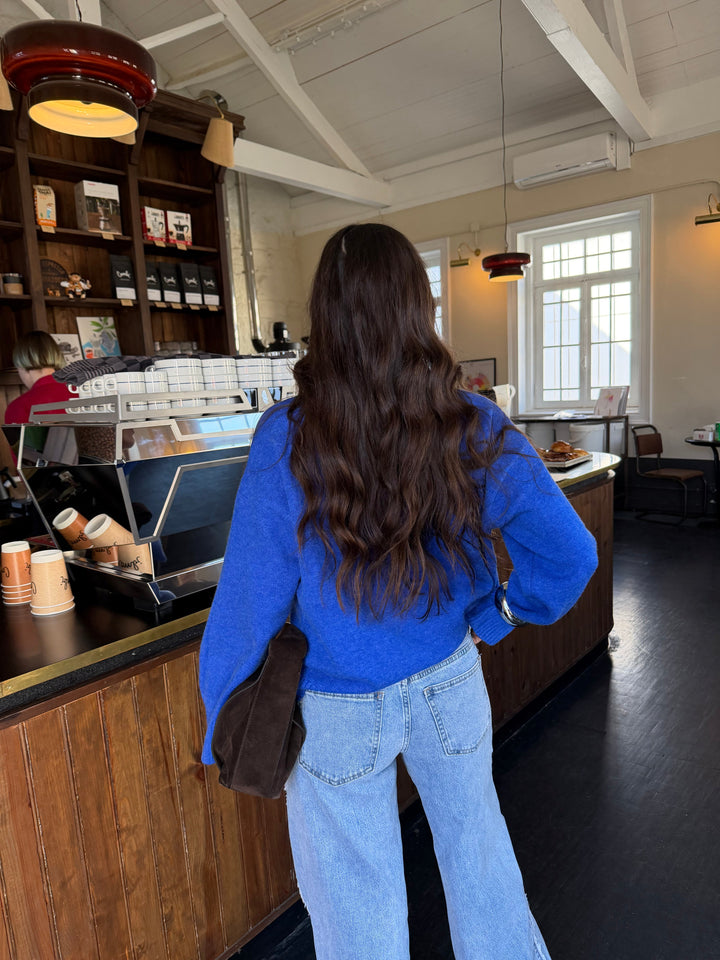 Women's oversized knit sweater with turtle neck and contrast piping