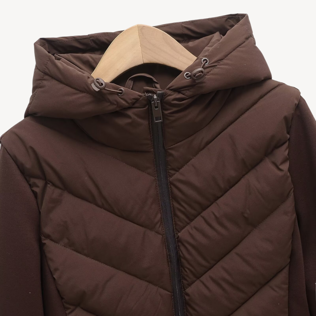Women's hooded quilted jacket with chevron stitching and zip front