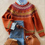Women's orange geometric knit sweater with crew neck and long sleeves