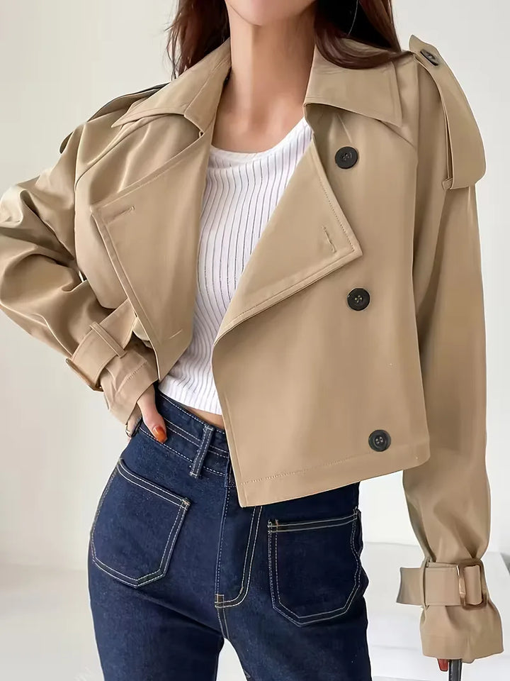 Women's beige cropped double-breasted trench coat with buckle cuffs