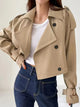 Women's beige cropped double-breasted trench coat with buckle cuffs