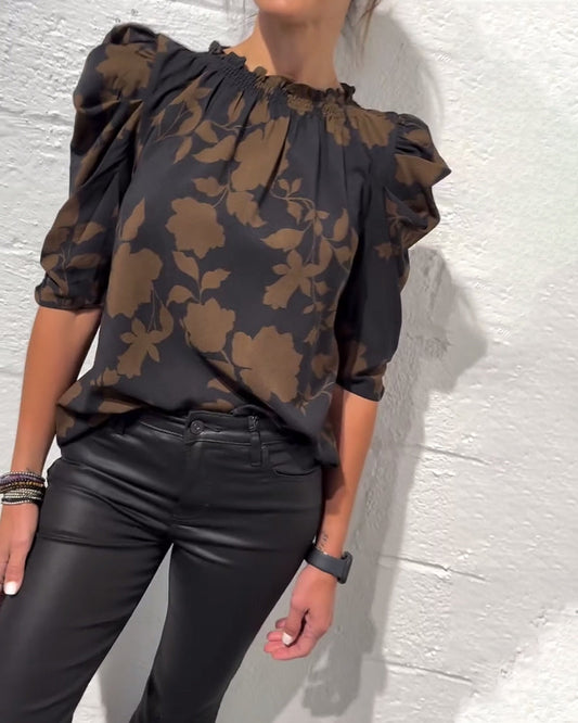 Women's floral blouse with ruched round neckline and 3/4 puff sleeves