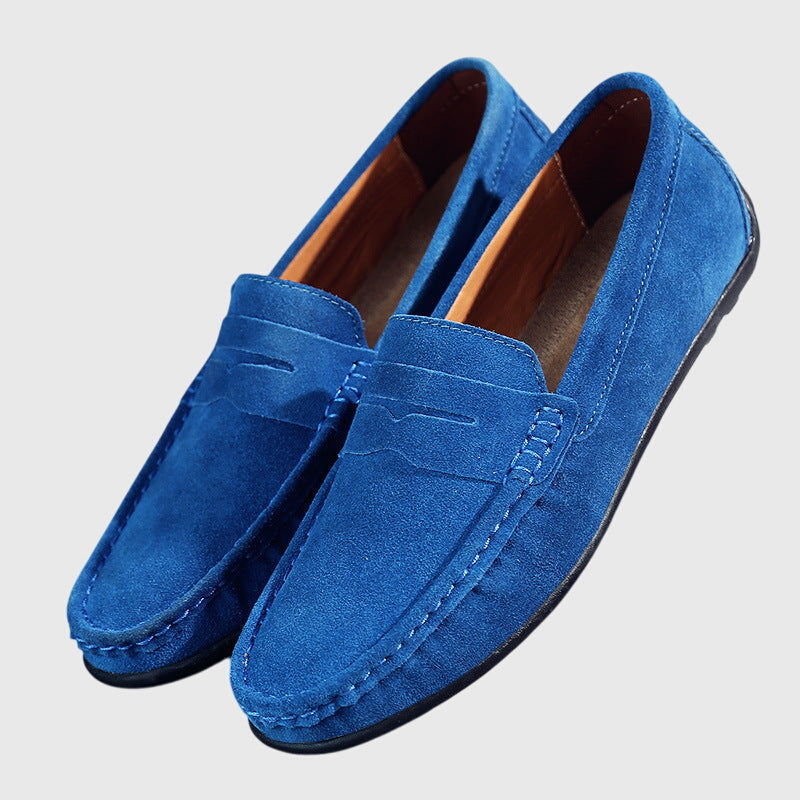 Classic slip-on loafers with penny strap and moc-toe stitching