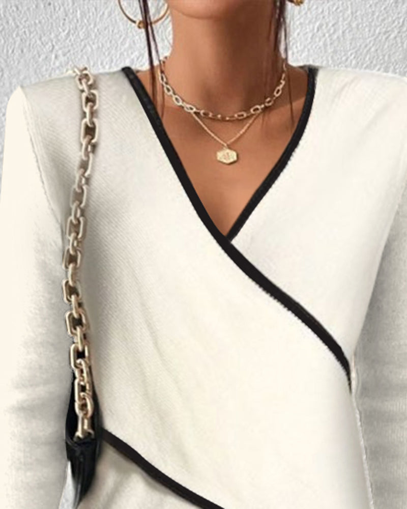 Women's white long-sleeve wrap sweater with black contrast trim