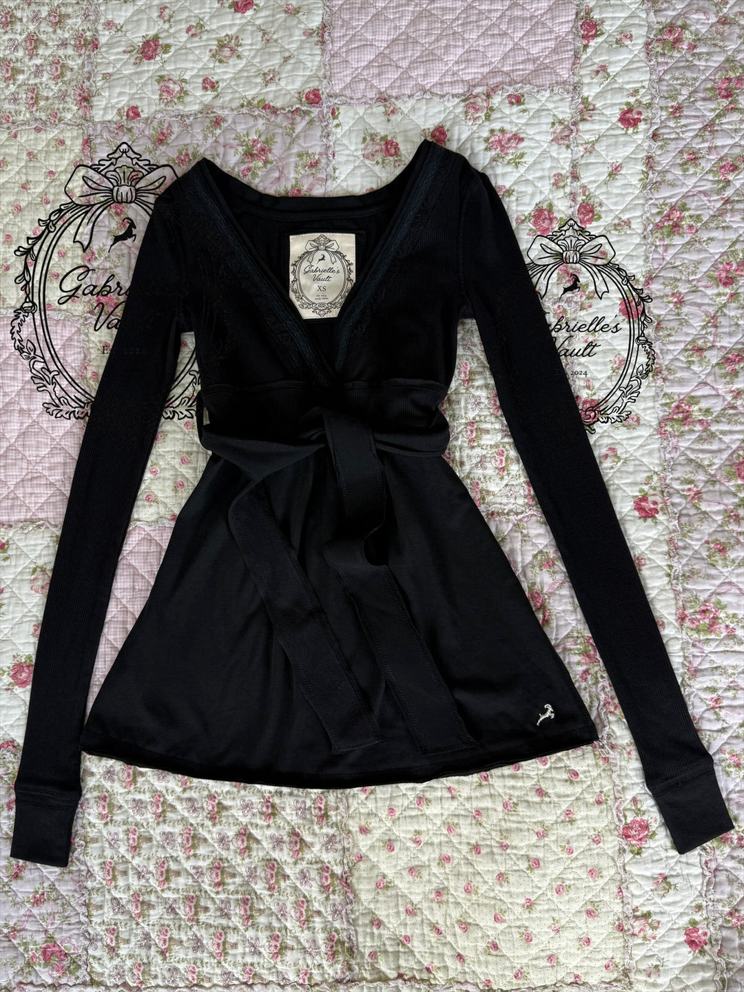 Women's long-sleeve wrap babydoll top with V-neck and waist tie