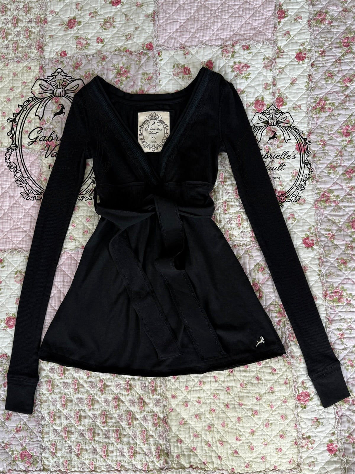 Women's long-sleeve wrap babydoll top with V-neck and waist tie