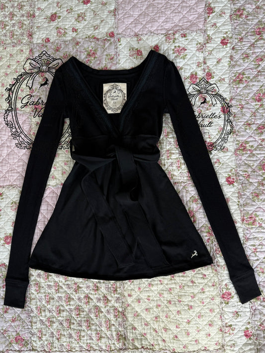 Women's long-sleeve wrap babydoll top with V-neck and waist tie