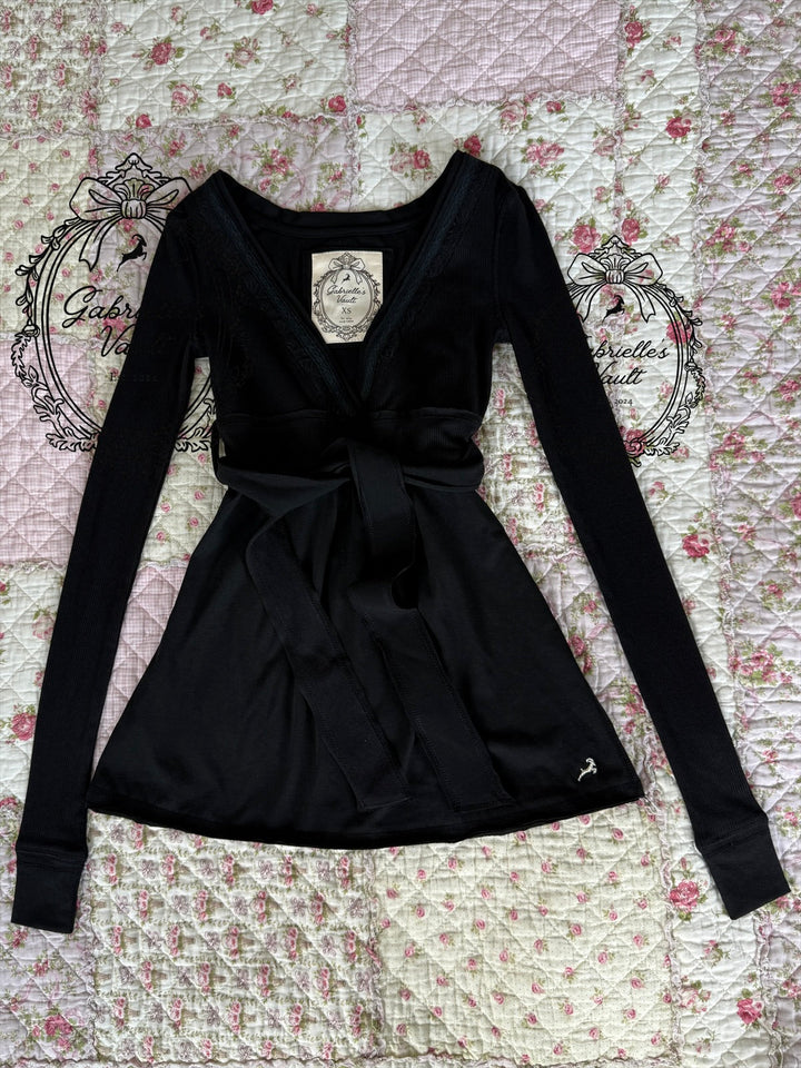 Women's long-sleeve wrap babydoll top with V-neck and waist tie
