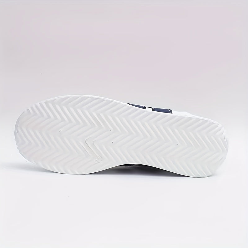 White lace-up sneakers with navy side stripes and flat soles