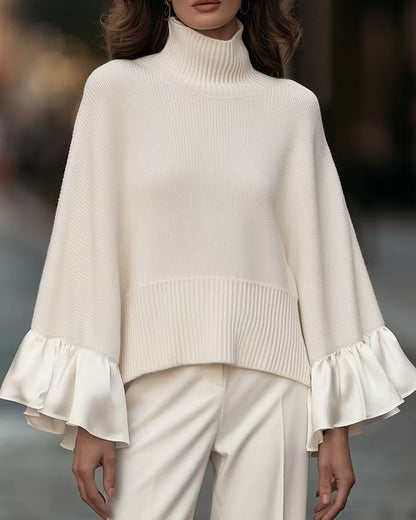 Women's cream turtleneck sweater with long ruffle sleeves and ribbed hem