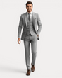 Men's three-piece suit with notched lapels, buttoned waistcoat and tailored trousers