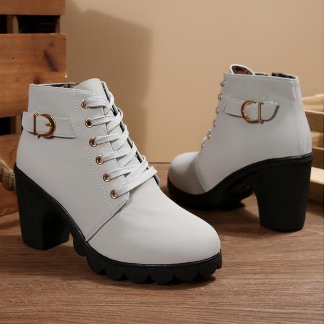 Women's black lace-up ankle boots with metal buckle detail and chunky sole