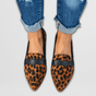 Women's pointed penny loafers with low heels and slip-on styling
