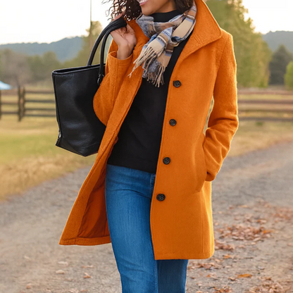 Women's button-front coat with lapel collar, long sleeves and side pockets