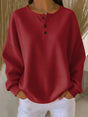 Women's long-sleeve waffle knit henley top with button placket