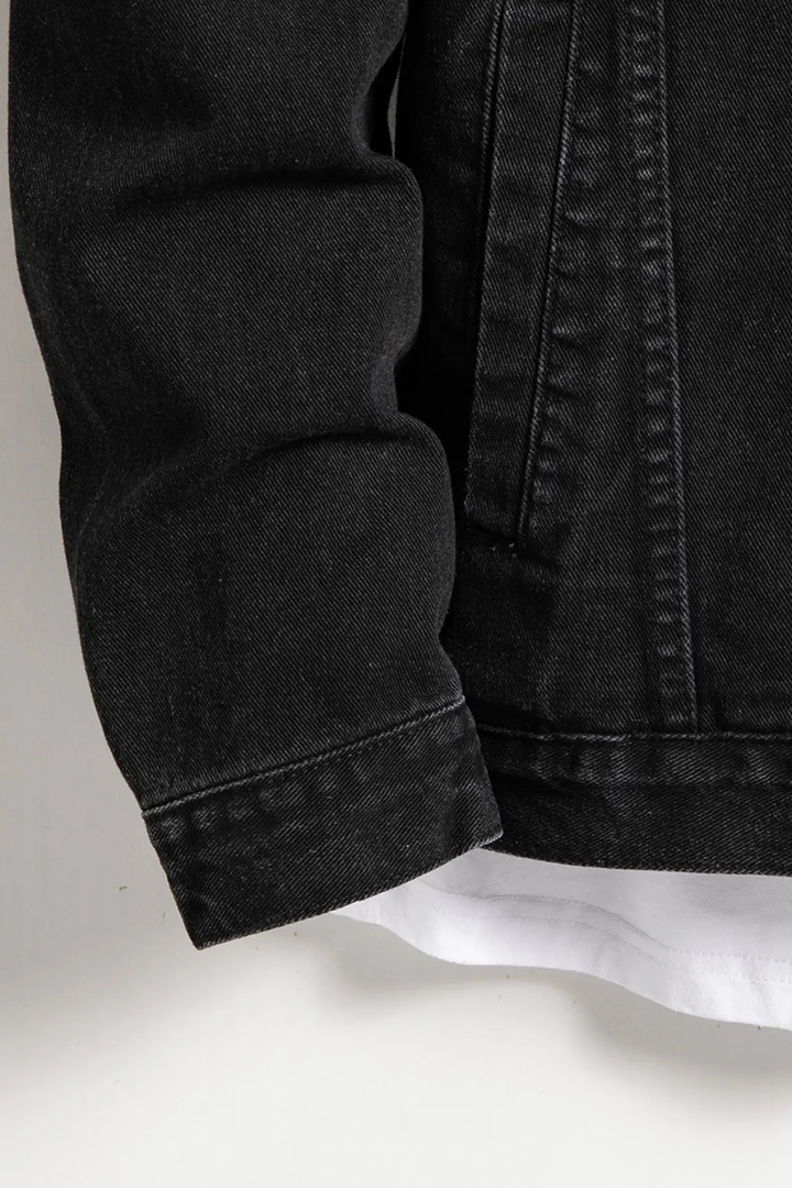 Men's black button-front denim jacket with chest flap pockets