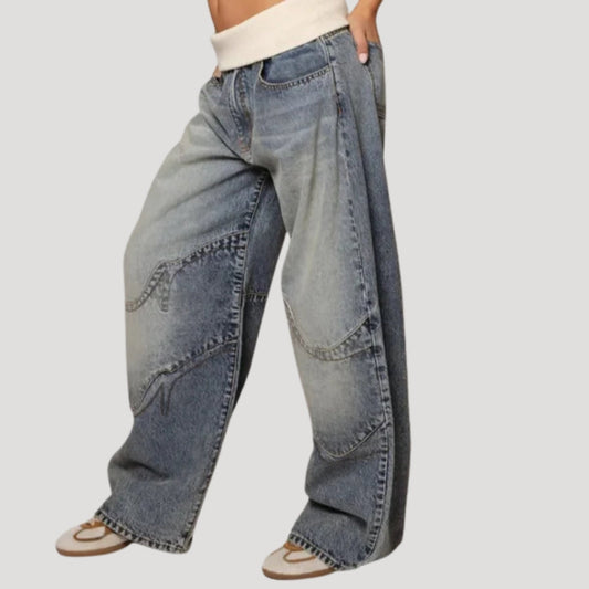 Women's blue low-rise wide-leg jeans with curved panel detailing