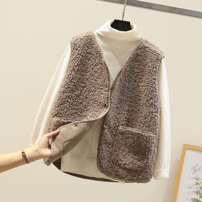 Women's textured sleeveless vest with button front and large patch pockets