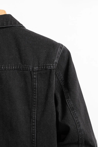 Men's black button-front denim jacket with chest flap pockets