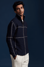 Men's navy zip jacket with stand collar and contrasting cross-stitch detailing