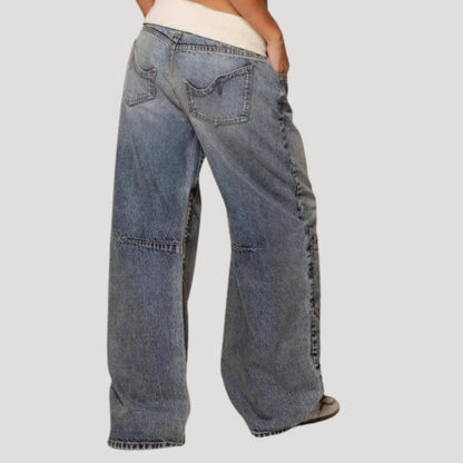 Women's blue low-rise wide-leg jeans with curved panel detailing