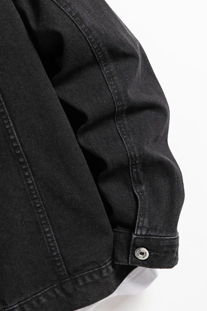 Men's black button-front denim jacket with chest flap pockets