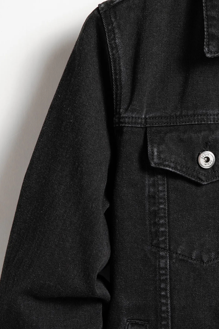 Men's black button-front denim jacket with chest flap pockets